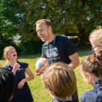 Students doing sports with a teacher, Rookwood School, Southampton, Hampshire.