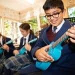 Students enjoying music class at this private, independent school