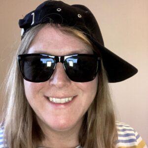 Rookwood School, Wiltshire's teacher wearing sunglasses & a hat.