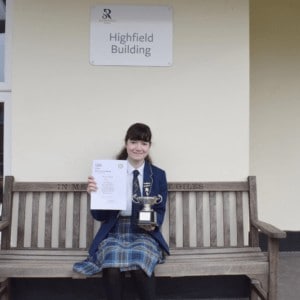 A female student with her Young Writers prize. Rookwood Secondary School. Private School. Andover, Hampshire.
