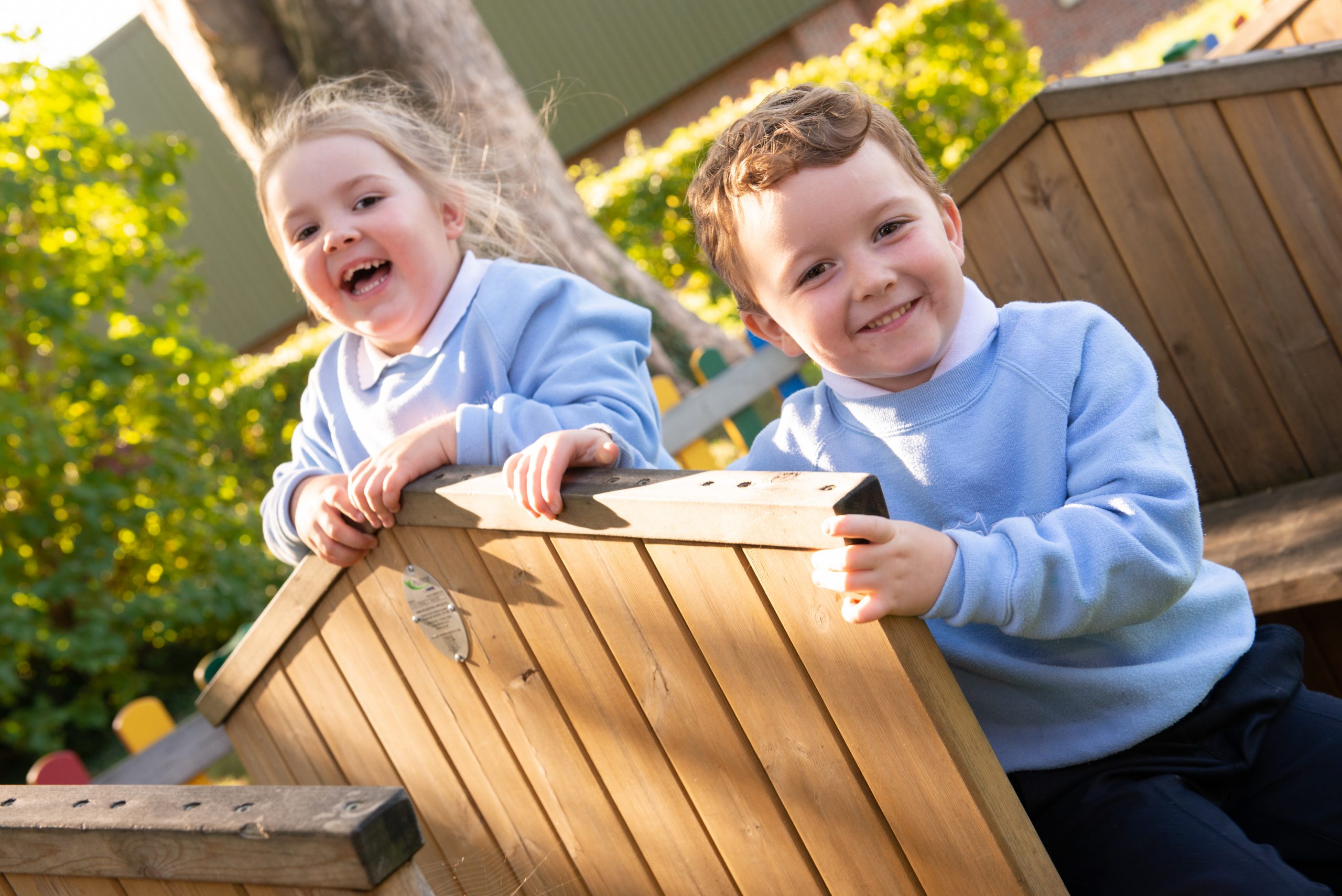 Two young children playing at Rookwood Nursery School in Andover, Hampshire.
