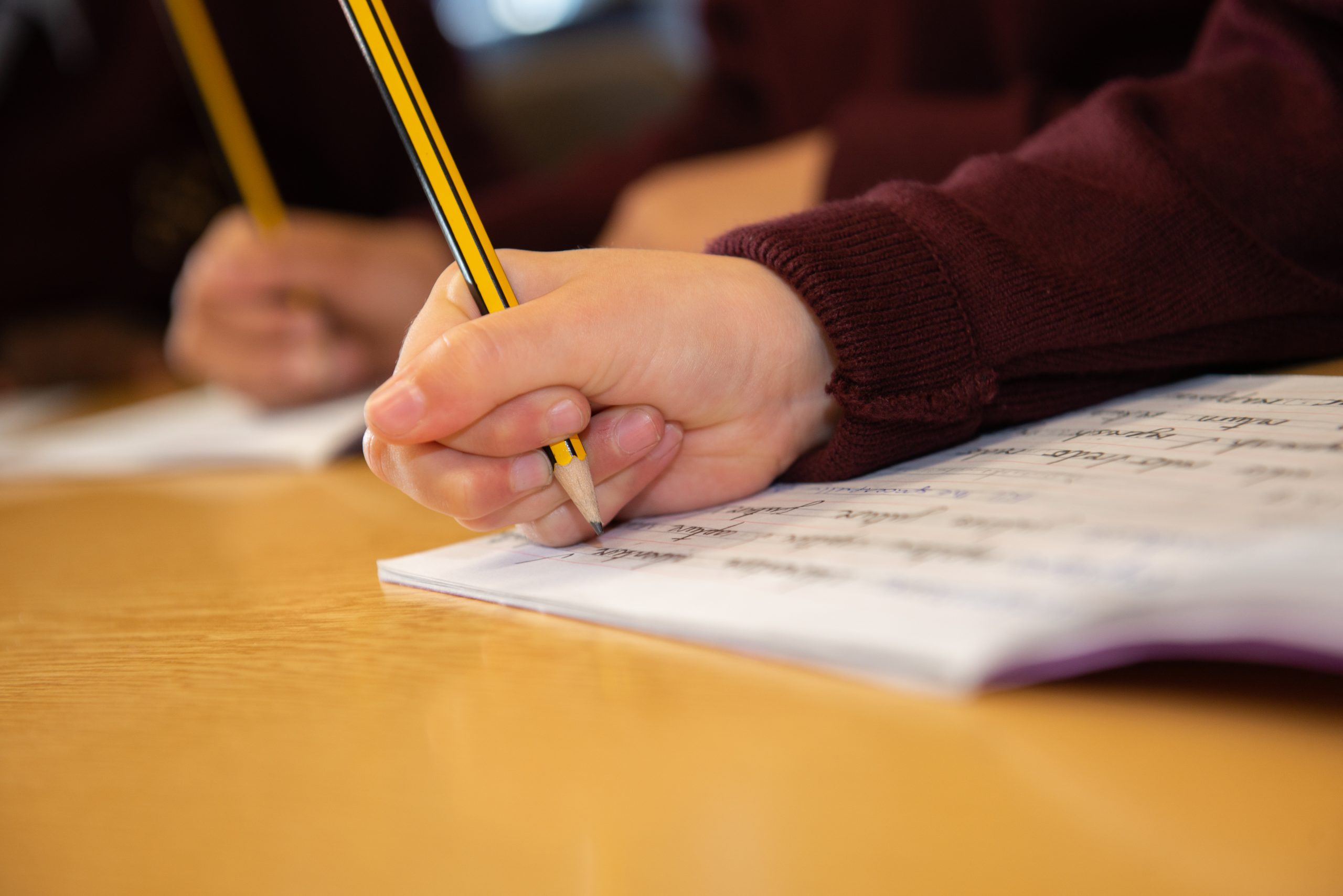 Students writing in a lesson or exam at Rookwood School in Andover, Hampshire.