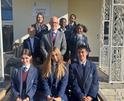 Mr Paul Robinson with students at Rookwood School