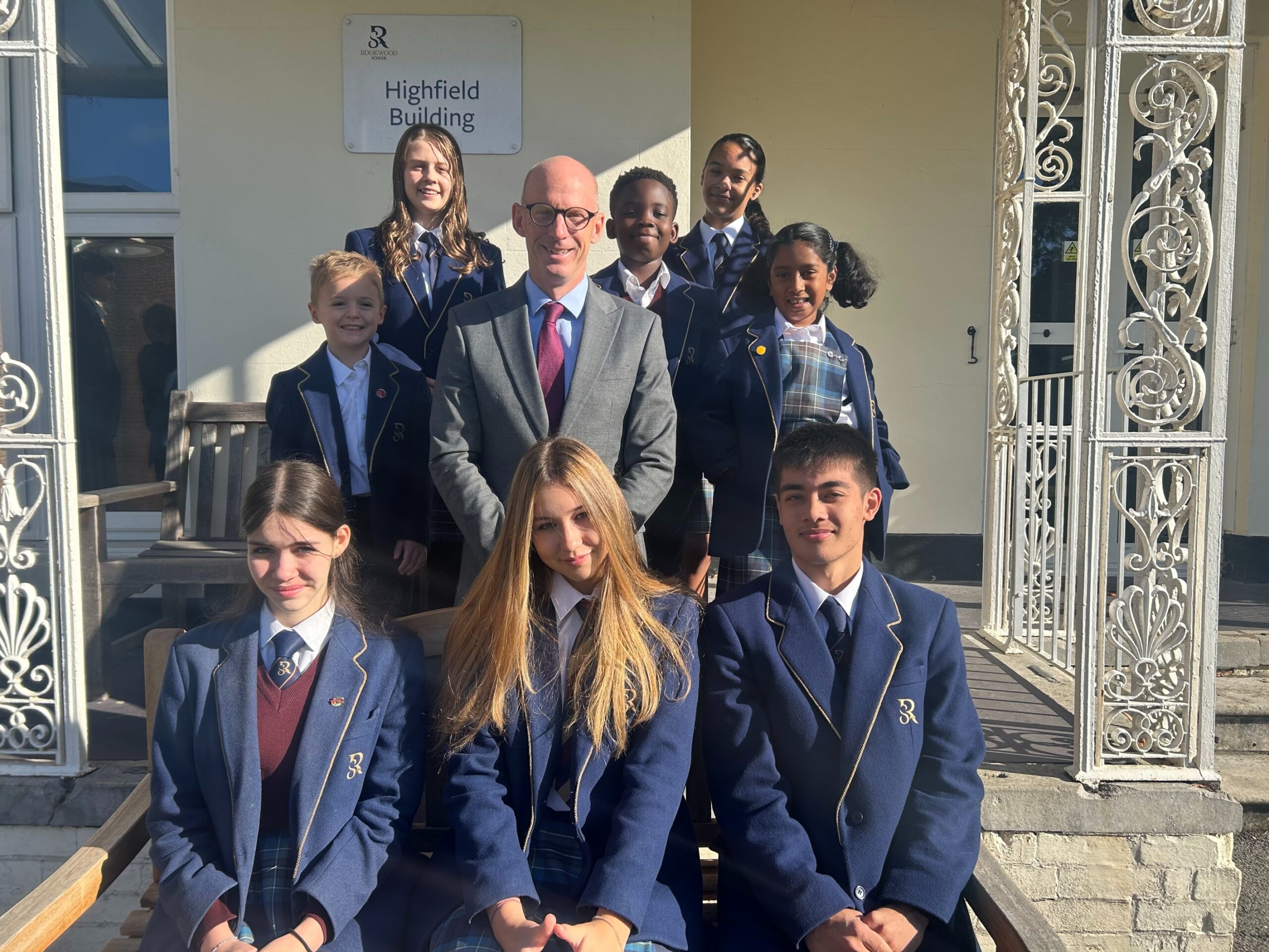 Mr Paul Robinson with students at Rookwood School