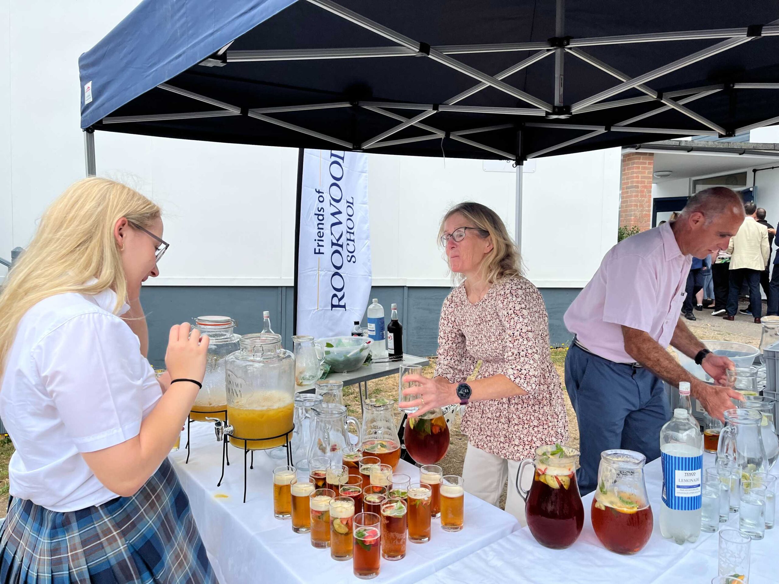 Adults serving drinks