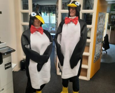 School staff dressed as penguins