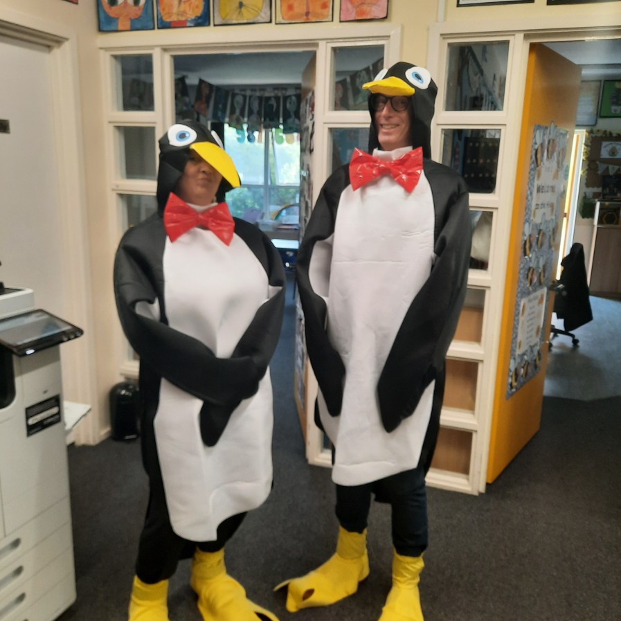 School staff dressed as penguins