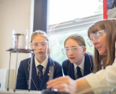 Girls looking at science experiment