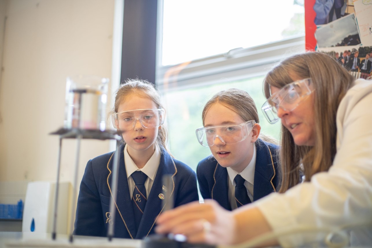 Girls looking at science experiment