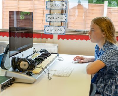 A Rookwood School student using computer software in music class.