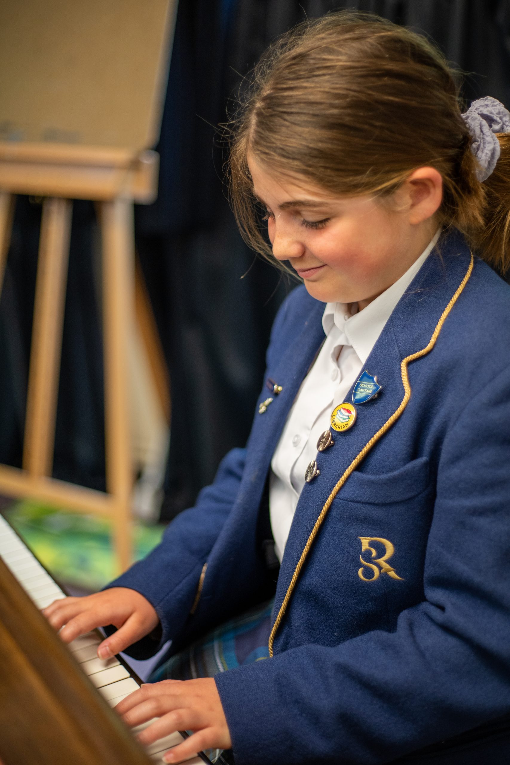 A Rookwood year 5 student playing piano.