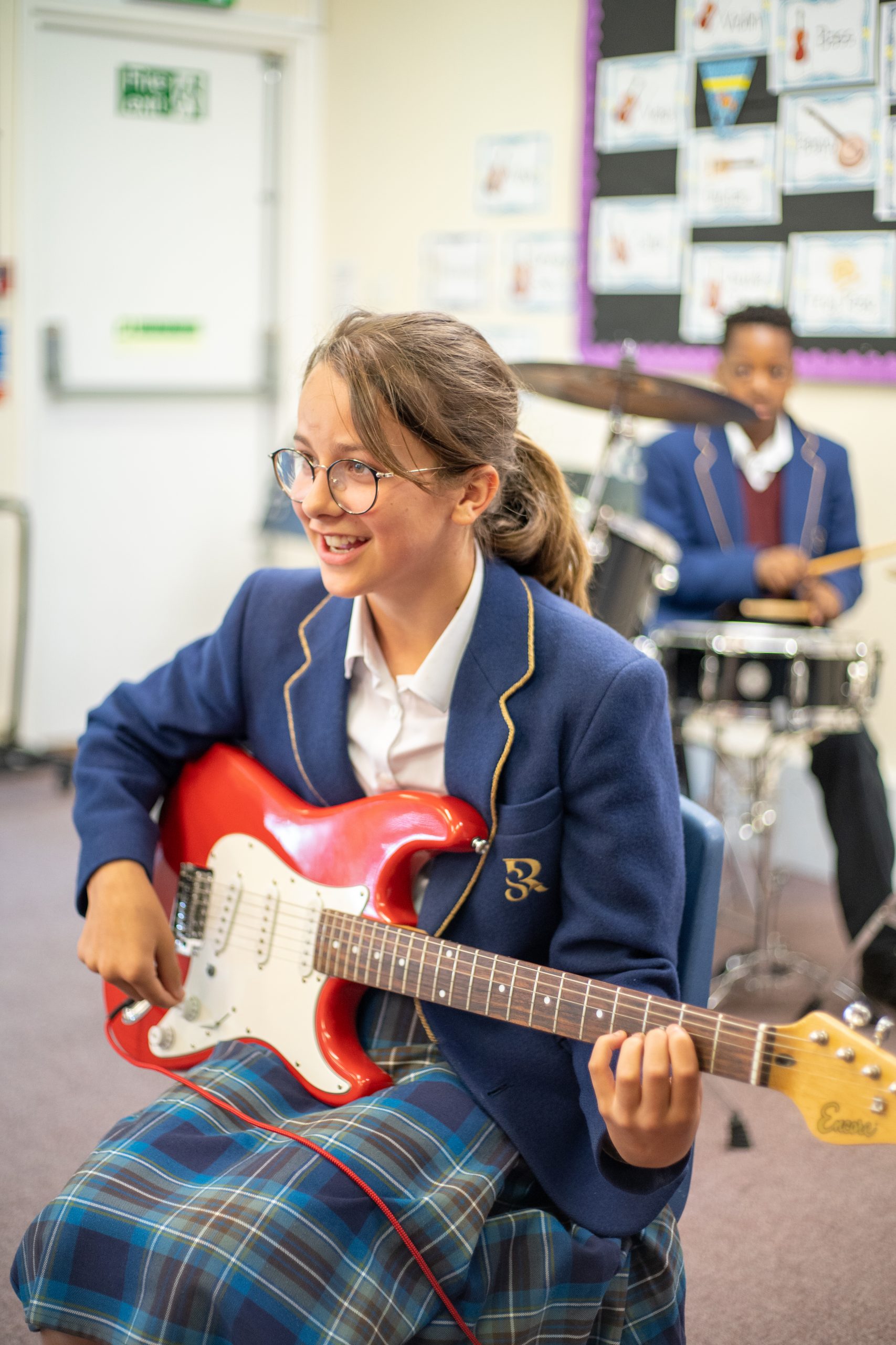 Rookwood prep school students playing instruments in music class.