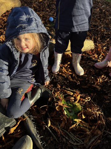 Reception pupils learning outside